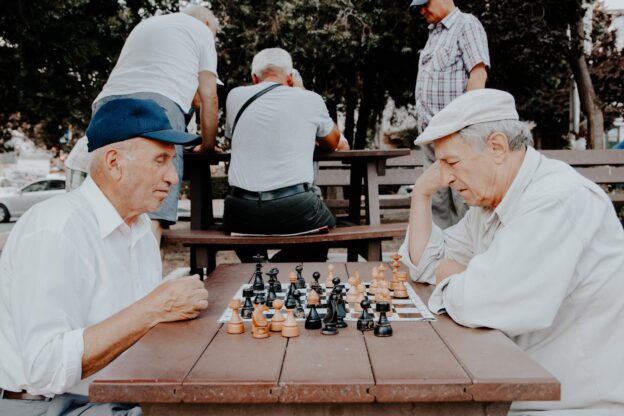 Two men playing chess after retirement