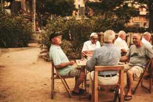 Group of old men sitting at a table