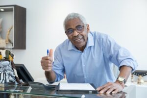 Man signing life insurance paperwork